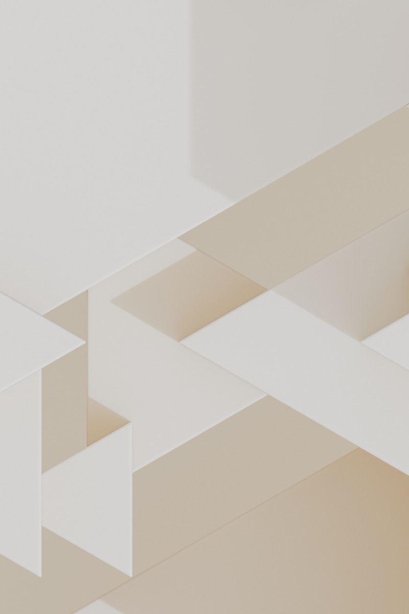 Geometric shapes create an abstract, minimalist composition.